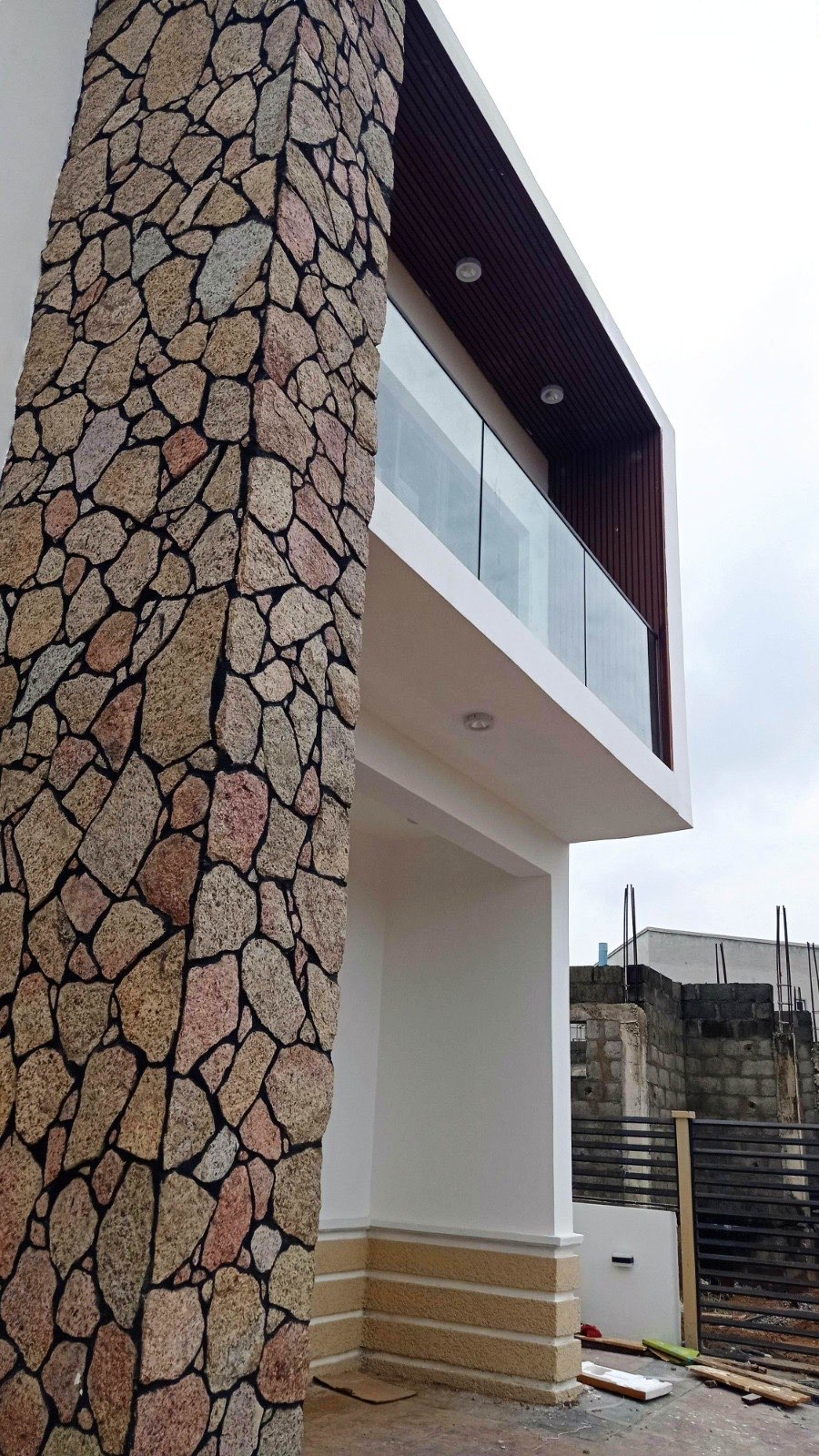 Stone clad facade detail at Wiser Court, Abuja